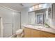 Well-lit bathroom featuring a shower with sliding glass doors, a single sink vanity, and ample counter space at 6955 N Durango Dr # 1093, Las Vegas, NV 89149