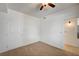 Neutral carpeted bedroom with white walls and a ceiling fan at 6955 N Durango Dr # 1093, Las Vegas, NV 89149