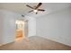 Spacious bedroom with neutral carpet, ceiling fan, and ensuite bath at 6955 N Durango Dr # 1093, Las Vegas, NV 89149