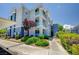 Well-maintained exterior with landscaping and architectural details, showcasing the building's facade on a sunny day at 6955 N Durango Dr # 1093, Las Vegas, NV 89149