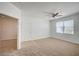 Inviting living room featuring carpet flooring, a window, and an entry door at 6955 N Durango Dr # 1093, Las Vegas, NV 89149
