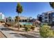 Community pool and building with a stone feature in a well-maintained setting at 6955 N Durango Dr # 1093, Las Vegas, NV 89149