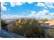 View from backyard looking toward neighborhood and mountains in the distance at 7342 Brisbane Hills St, Las Vegas, NV 89166