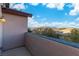 Balcony area with stucco wall and mountain views in the distance at 7342 Brisbane Hills St, Las Vegas, NV 89166