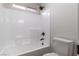 A tub and shower combination with white tiling at 7342 Brisbane Hills St, Las Vegas, NV 89166