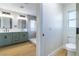 Modern bathroom with a double sink vanity, updated fixtures and walk-in shower at 7342 Brisbane Hills St, Las Vegas, NV 89166
