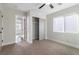 Well-lit bedroom featuring closet, ceiling fan and carpet at 7342 Brisbane Hills St, Las Vegas, NV 89166
