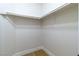 An empty closet with wood-look floors and a white closet rod at 7342 Brisbane Hills St, Las Vegas, NV 89166