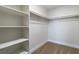 Spacious walk-in closet features ample shelving and hanging space for organized storage at 7342 Brisbane Hills St, Las Vegas, NV 89166