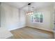 Bright dining area with modern lighting fixture and light wood floors at 7342 Brisbane Hills St, Las Vegas, NV 89166