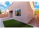 Exterior side view with artificial grass, brick patio and wall at 7342 Brisbane Hills St, Las Vegas, NV 89166