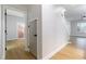 Hallway with doors to other rooms, staircase, and wood laminate flooring at 7342 Brisbane Hills St, Las Vegas, NV 89166