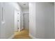 Hallway with neutral paint, updated baseboards and wood floors at 7342 Brisbane Hills St, Las Vegas, NV 89166