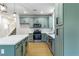 Updated kitchen featuring stainless steel appliances, island, and modern lighting at 7342 Brisbane Hills St, Las Vegas, NV 89166