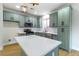 Beautiful kitchen featuring modern appliances, a large island, and stylish cabinetry at 7342 Brisbane Hills St, Las Vegas, NV 89166