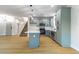 Modern kitchen with stylish island, appliances, and plenty of cabinets in an open floor plan at 7342 Brisbane Hills St, Las Vegas, NV 89166