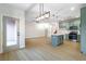 Spacious open-concept living room with kitchen featuring stainless appliances and island at 7342 Brisbane Hills St, Las Vegas, NV 89166