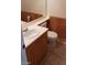 Cozy bathroom with wood paneling and classic fixtures at 7517 Apple Cider St, Las Vegas, NV 89131