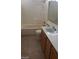 Bathroom with tub, toilet, vanity, and tile flooring at 7517 Apple Cider St, Las Vegas, NV 89131