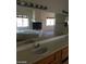 Bright bathroom featuring double sinks, a soaking tub, and a fireplace at 7517 Apple Cider St, Las Vegas, NV 89131