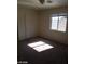 Bedroom with a window, carpet, and a door at 7517 Apple Cider St, Las Vegas, NV 89131