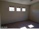 Bedroom featuring three well-lit windows at 7517 Apple Cider St, Las Vegas, NV 89131