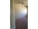 This bedroom features carpet flooring and a ceiling fan at 7517 Apple Cider St, Las Vegas, NV 89131