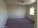 This bedroom features carpet flooring and a window for natural light at 7517 Apple Cider St, Las Vegas, NV 89131
