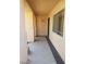 Covered entryway featuring tile floors and neutral colored walls leading to the front door at 7517 Apple Cider St, Las Vegas, NV 89131