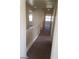 Bright hallway with railing leading to various rooms upstairs at 7517 Apple Cider St, Las Vegas, NV 89131