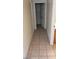 Hallway with tile flooring leading to various rooms at 7517 Apple Cider St, Las Vegas, NV 89131