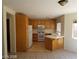 Bright kitchen featuring wood cabinets and white appliances at 7517 Apple Cider St, Las Vegas, NV 89131