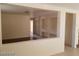 Open concept living room with light walls, tile floors and entry view at 7517 Apple Cider St, Las Vegas, NV 89131