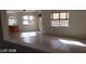 Bright living room with tiled flooring and natural light from multiple windows at 7517 Apple Cider St, Las Vegas, NV 89131