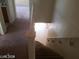 View from the top of the stairs looking down, showing carpeted steps at 7517 Apple Cider St, Las Vegas, NV 89131