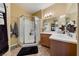 Bathroom featuring glass enclosed shower and double vanity at 7701 W Robindale Rd # 274, Las Vegas, NV 89113
