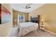 Cozy bedroom features carpet, ceiling fan, and neutral paint at 7701 W Robindale Rd # 274, Las Vegas, NV 89113