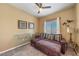 Bedroom includes a ceiling fan and a seating area at 7701 W Robindale Rd # 274, Las Vegas, NV 89113