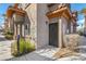 Charming front entrance with wrought iron door, lush landscaping, and well-maintained pathway at 7701 W Robindale Rd # 274, Las Vegas, NV 89113
