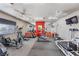 Community gym with exercise equipment and mirrors at 7701 W Robindale Rd # 274, Las Vegas, NV 89113
