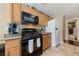 Functional kitchen includes oak cabinets, modern appliances, and neutral countertops at 7701 W Robindale Rd # 274, Las Vegas, NV 89113