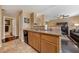 Cozy kitchen featuring granite countertops, stainless steel dishwasher, and tile flooring at 7701 W Robindale Rd # 274, Las Vegas, NV 89113