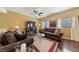 Cozy living room featuring comfortable seating, ceiling fan, and abundant natural light at 7701 W Robindale Rd # 274, Las Vegas, NV 89113