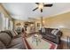 Open-concept living room with hardwood floors, comfortable seating, and neutral color scheme at 7701 W Robindale Rd # 274, Las Vegas, NV 89113