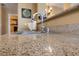 A close-up of a sink with granite countertops and tile flooring at 7701 W Robindale Rd # 274, Las Vegas, NV 89113