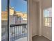 View from balcony featuring iron railing, building facade and blue sky at 7856 Carysford Ave, Las Vegas, NV 89178