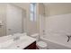 Well-lit bathroom with a vanity, toilet, and tiled shower-tub combination at 7856 Carysford Ave, Las Vegas, NV 89178