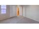 Bedroom with carpet, light walls, a window, a closet, and entry to stairway at 7856 Carysford Ave, Las Vegas, NV 89178