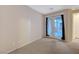 Spacious carpeted bedroom with access to a private outdoor patio through glass doors at 7856 Carysford Ave, Las Vegas, NV 89178