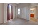 Neutral bedroom with carpet, light walls, balcony door and an ensuite bathroom at 7856 Carysford Ave, Las Vegas, NV 89178